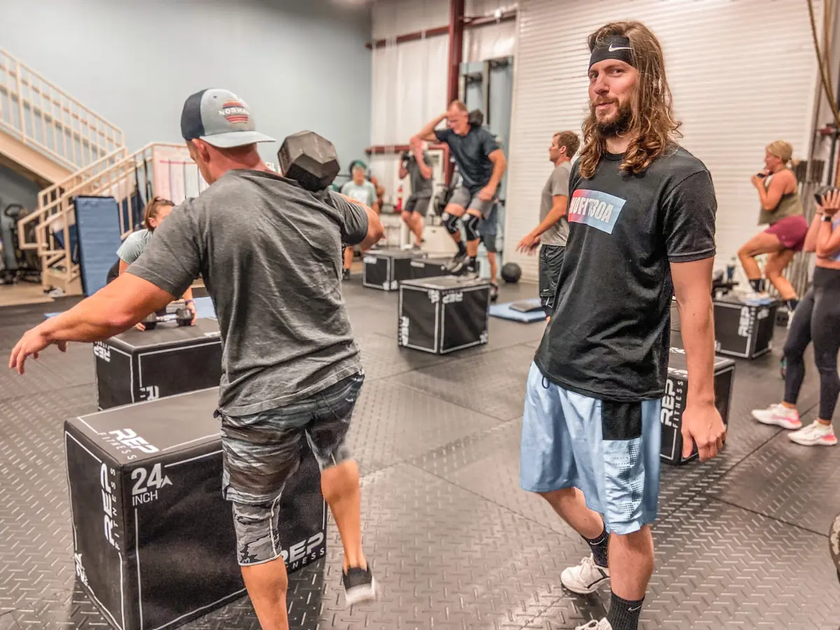 Members doing box jumps mid-class