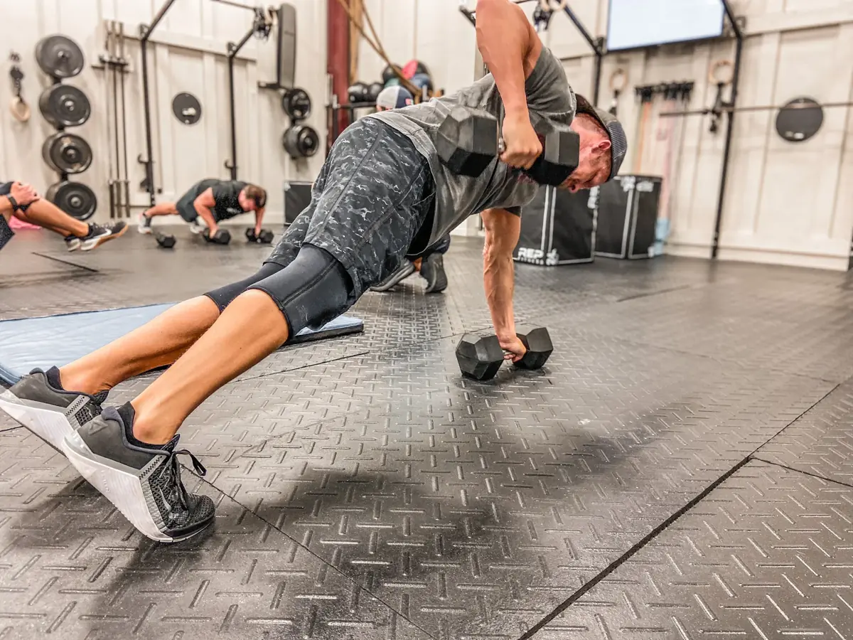 A member mid-burpee