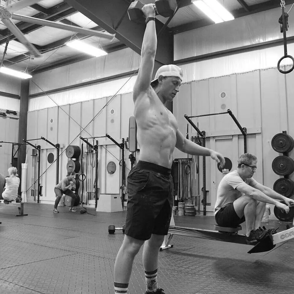 Robby mid-workout next to the rowers