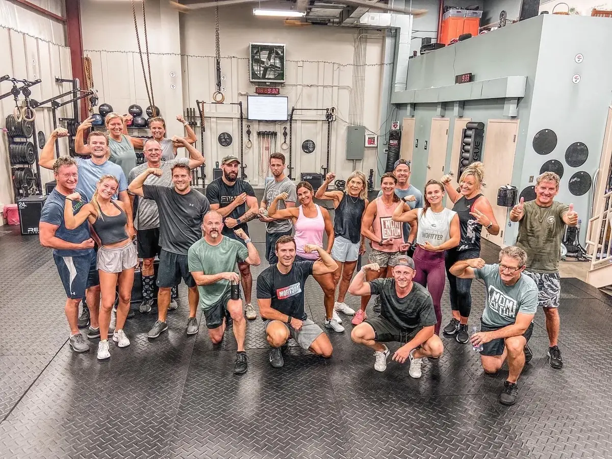 A packed class smiling for the camera