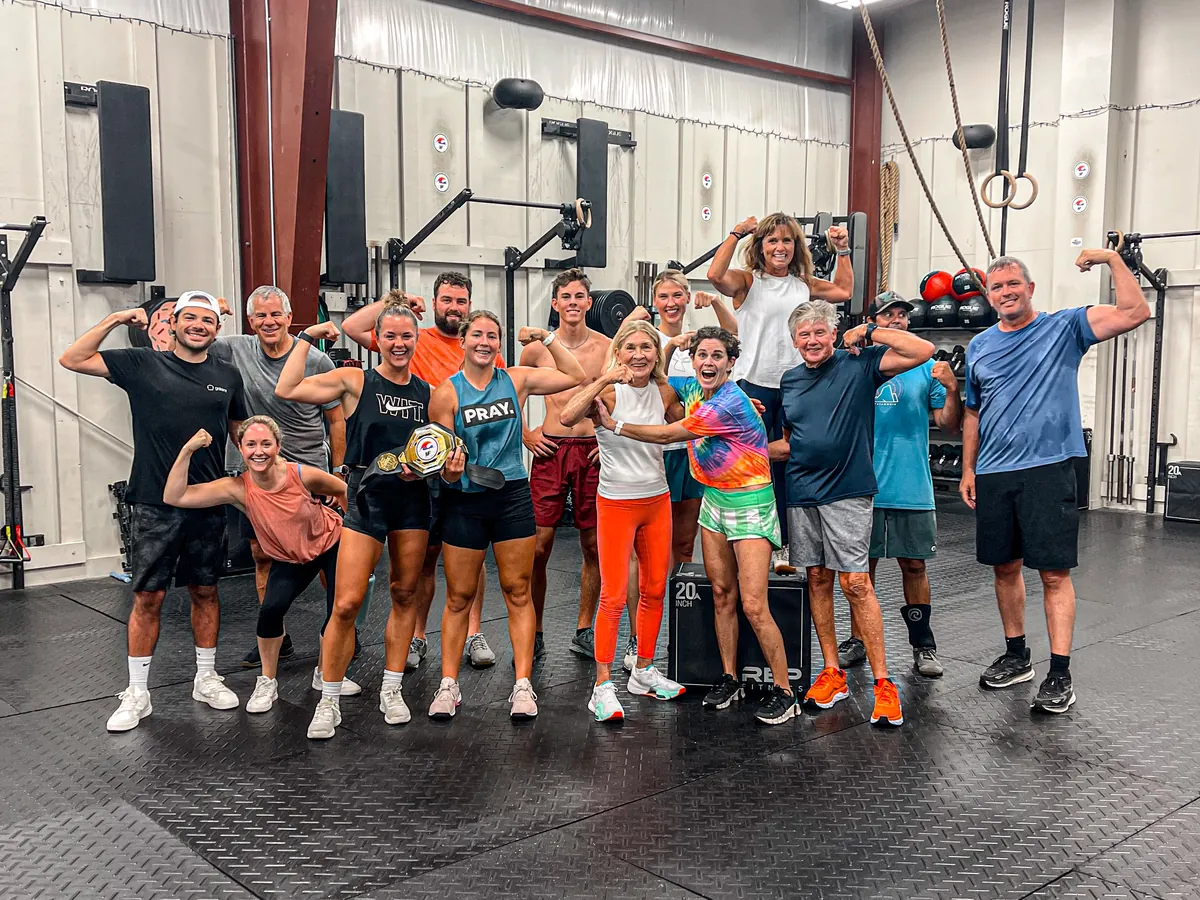 A class flexing together after the workout