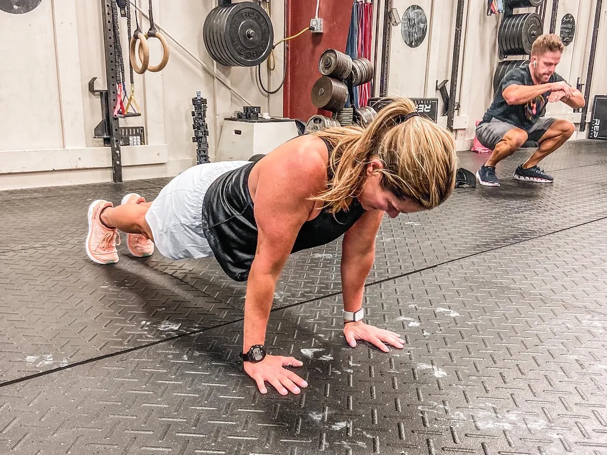 Members working through push-ups and squats